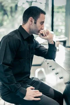 Thinking at the bar Stock Photos