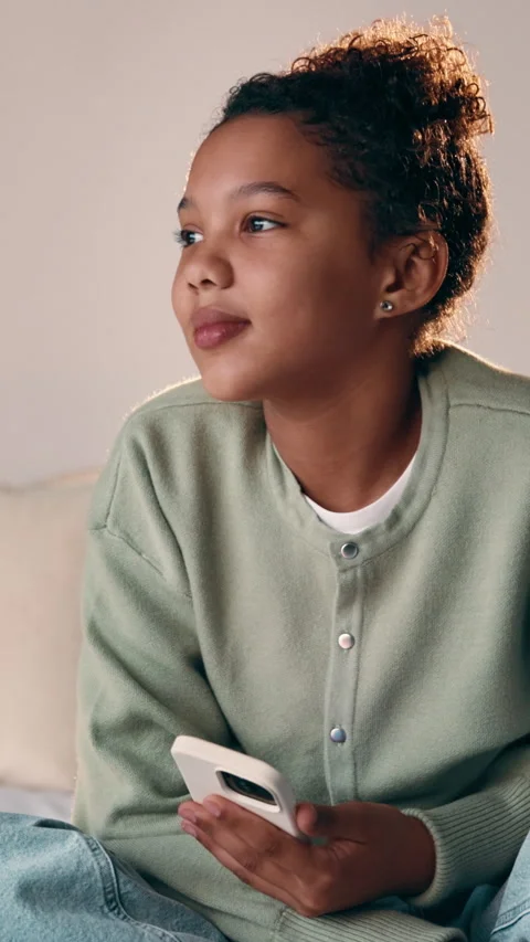 Thinking, child and relax with phone on bed for vision, dreaming and ideas for Stock Footage 335788232