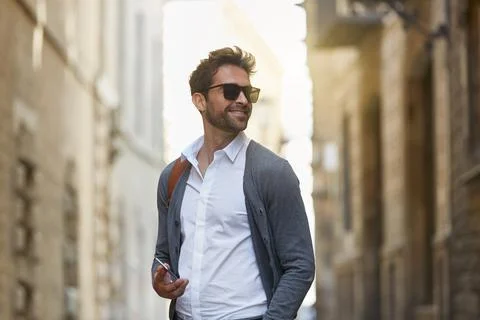Thinking, commute and man in town with phone, mindfulness and morning trave.. Stock Photos