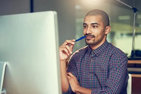 Thinking, computer and business man with idea, planning or problem solving at Stock Photos