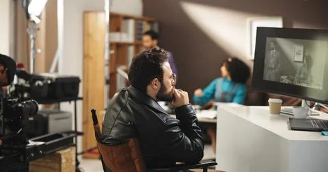 Thinking, computer and director with man on set for filming, production and Stock Photos