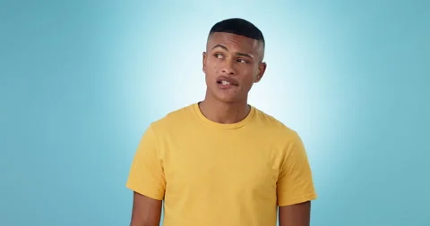 Thinking, confused and man with doubt, ideas and problem solving on a blue Stock Footage 254117203