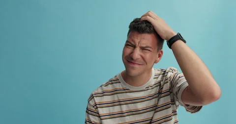 Thinking, confused and man scratching head in studio with why, questions or Stock Footage 264559927