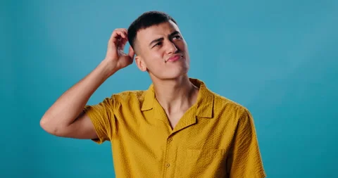 Thinking, confused and man in studio with idea, hand on head for memory or Stock Footage 280794904