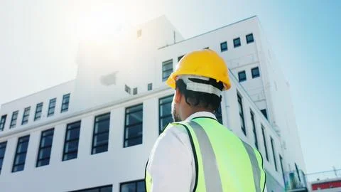 Thinking, construction and back of man in city for planning, inspection and.. Stock Photos