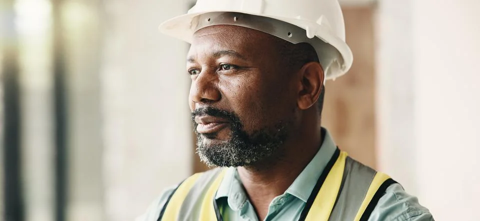 Thinking, construction and black man in building for inspection, evaluation.. Stock Photos
