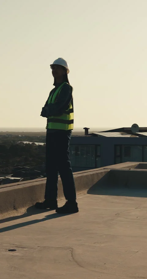Thinking, construction and woman on rooftop for building project, renovation and Stock Footage 345655788