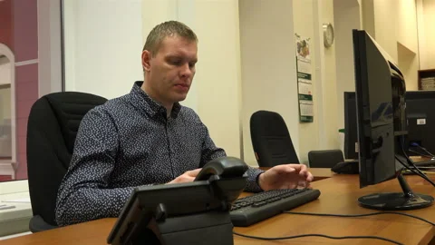 Thinking for a couple of minutes, the guy continued working Stock Footage 111166272