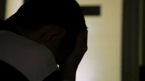 Thinking criminal man sitting alone, regret for past wrongs, review his actions Stock Footage 85328717