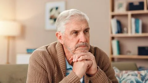 Thinking, depression and memory with old man on sofa for Alzheimer, retirement 写真素材