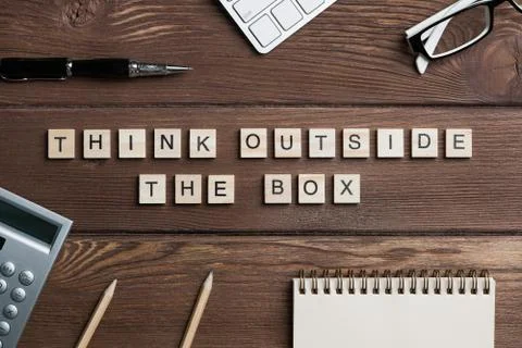 Thinking different concept on wooden table collected of game elements Stock Photos
