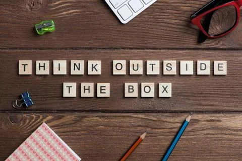 Thinking different concept on wooden table collected of game elements Stock Photos