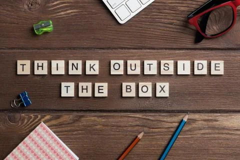 Thinking different concept on wooden table collected of game elements Stock Photos