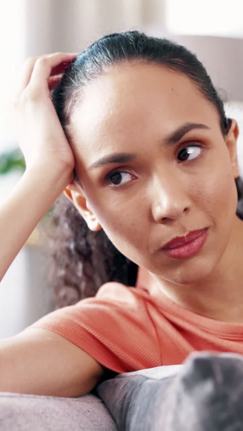 Thinking, doubt and woman on sofa in home with reflection for mistake, sad Stock Footage 333446068