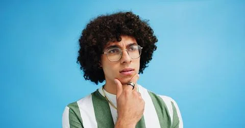 Thinking, doubt face and man with glasses for brainstorming, problem solving or Stock Photos