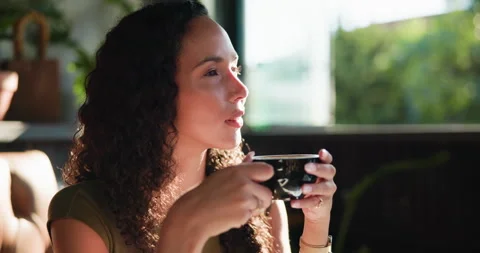 Thinking, drinking and woman in cafe, relax and nostalgia for memory, caffeine Stock Footage 330925173