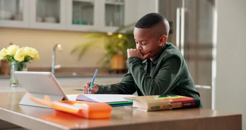 Thinking, elearning and tablet with black child in kitchen in home for reading Stock Footage 341561441