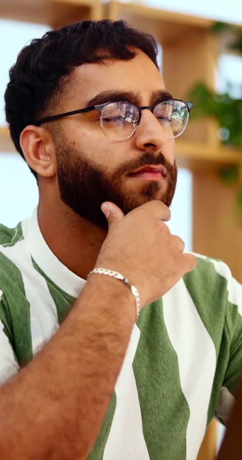 Thinking, glasses and man with laptop in office, copywriting and plan for Stock Footage 338379809