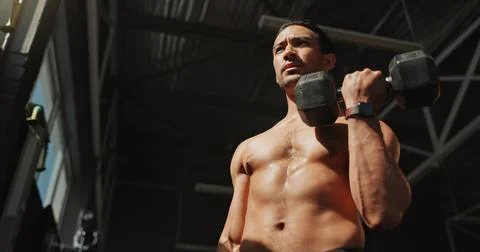 Thinking, gym and bodybuilder man with dumbbells or weights for training Stock Photos