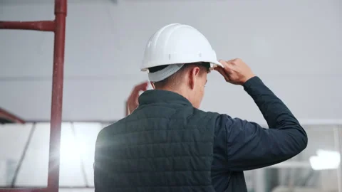 Thinking, helmet and back of man in building for inspection, safety compliance Stock Footage 341546689