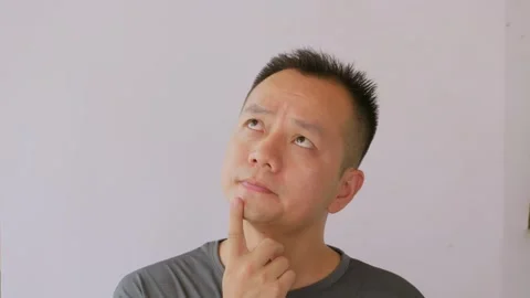Thinking idea and Asian man with question doubt or decision Stock Footage 342470200