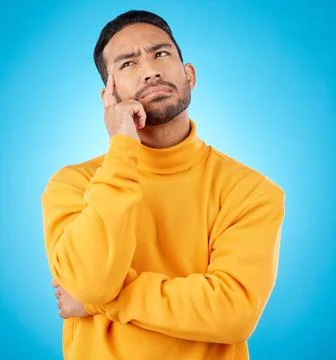 Thinking, idea and young man in a studio with doubt, confused or choice facial Foto stock