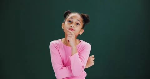Thinking, ideas and child in studio with solution, choice or decision by mo.. 库存照片