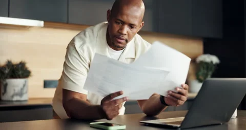 Thinking, laptop and black man with paperwork for home, travel insurance and Stock Footage 336842708