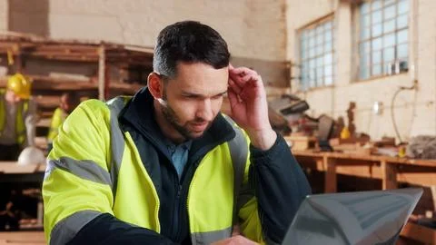 Thinking, laptop and man in workshop for construction contract, material su.. Stock Photos