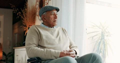 Thinking, loss or old man in home with wheelchair, grief or memory of past .. Stock Photos
