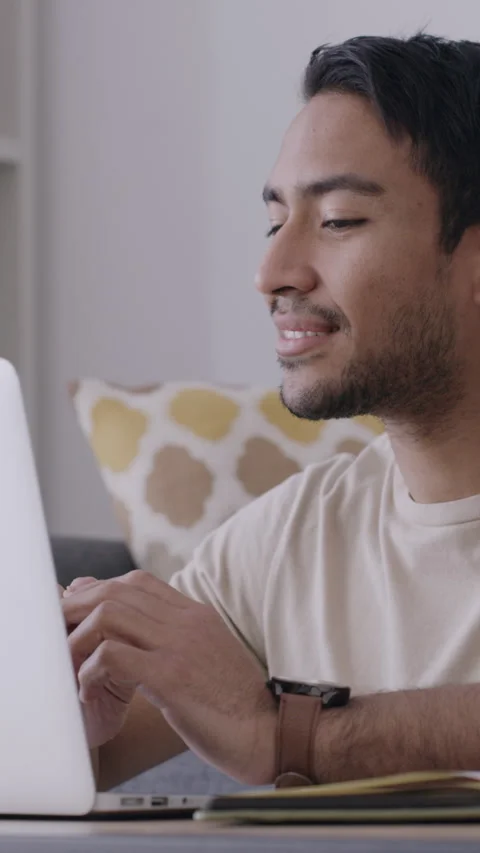 Thinking, man and creative with laptop, lounge and author with freelance project Stock Footage 335841243