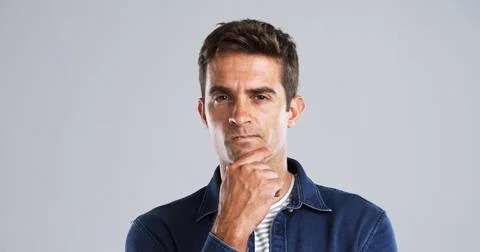 Thinking, man and doubt with portrait in studio for fake news, problem solving Stock Photos