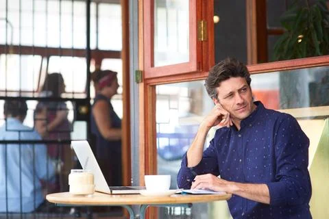 Thinking, man and freelancer in cafe with notebook, planning and schedule f.. Stock Photos