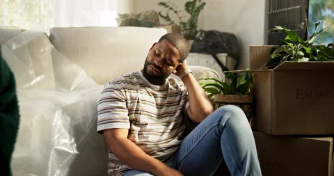 Thinking, man and sad for eviction, boxes and stress for relocation, living room Video stock 312689999