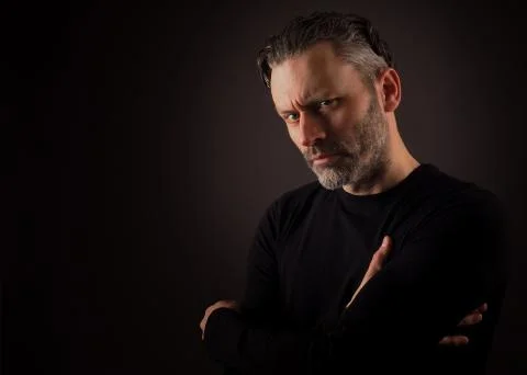 Thinking man on a dark background Stock Photos