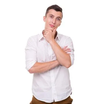 Thinking man isolated on white background. Closeup portrait of a casual young Foto stock