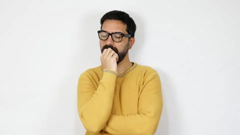 Thinking man looking up and around looking for inspiration on white background Stock Footage 165806933