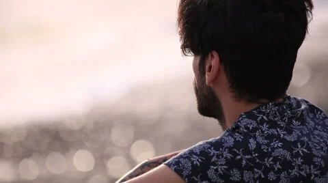 Thinking man relaxing on the beach Stock Footage 58251508