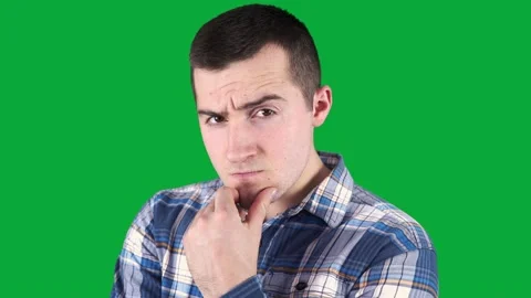 Thinking man stands on a green screen. chromakey Stock Footage 145930684