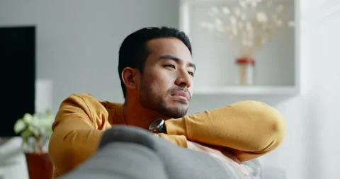 Thinking, memory and sad asian man on a sofa with nostalgia, depression or grief Stock Footage 249049859