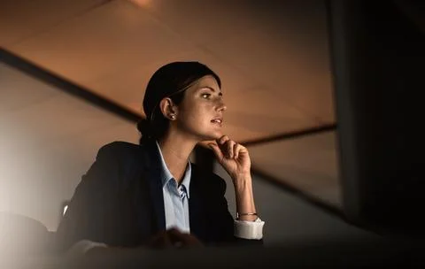Thinking, night work and problem solving, woman in office reading email or Stock Photos