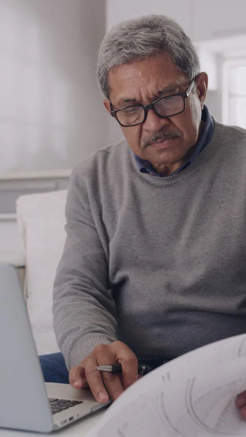 Thinking, old man and research with laptop, house and plan for retirement with Stock Footage 329768373
