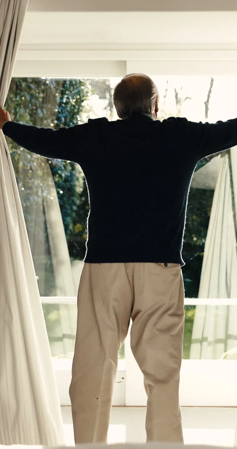 Thinking, opening and old man at window with curtain, daydreaming and chill Stock Footage 342255714
