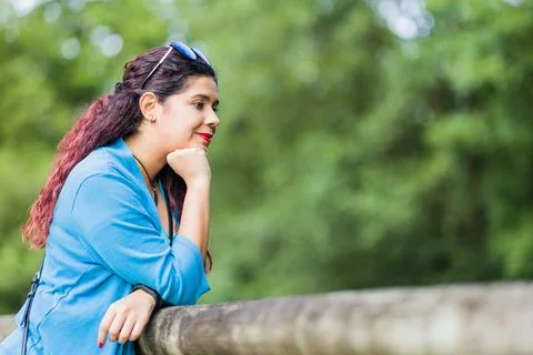 Thinking outside in nature wellness self care relaxation. south american woman Stock Photos
