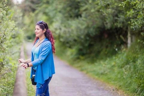 Thinking outside in nature wellness self care relaxation. south american woman Stock Photos