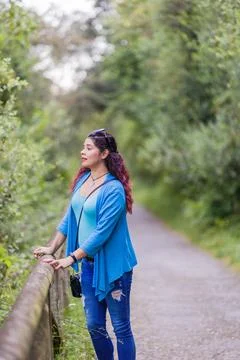 Thinking outside in nature wellness self care relaxation. south american woman Stock Photos