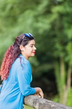 Thinking outside in nature wellness self care relaxation. south american woman Stock Photos
