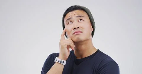 Thinking, planning and man in studio with uncertain for decision, brainstorming 库存照片