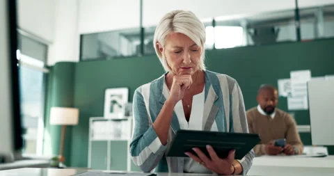 Thinking, problem solving or mature businesswoman on tablet reading news for Stock Footage 276019830