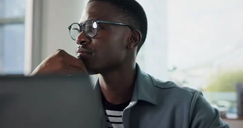 Thinking, programmer and black man with laptop in office, planning or idea for Stock Footage 316695693